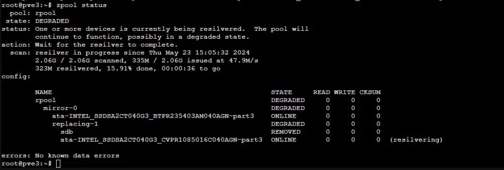 zpool status showing the new disk resilvering